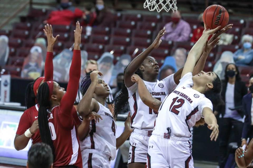 South Carolina Gamecocks forward Laeticia Amihere (15) and guard Brea Beal (12) bring down a rebound during the first half of action against Alabama.