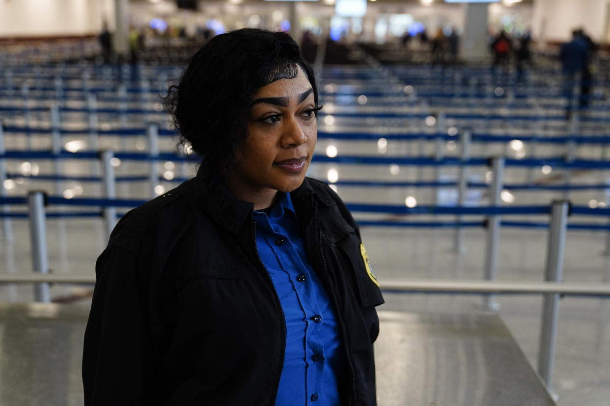 Janecia Howard, poses for a portrait at the Transportation Security Administration security area at the Hartsfield-Jackson Atlanta International Airport on Wednesday, Jan. 25, 2023, in Atlanta. Howard was monitoring the X-ray machine when she realized she was looking at a gun in a passenger’s laptop bag. She immediately flagged it as a “high-threat” item and police were notified. It turns out the passenger was a very apologetic businessman who said he simply forgot. (AP Photo/Brynn Anderson)