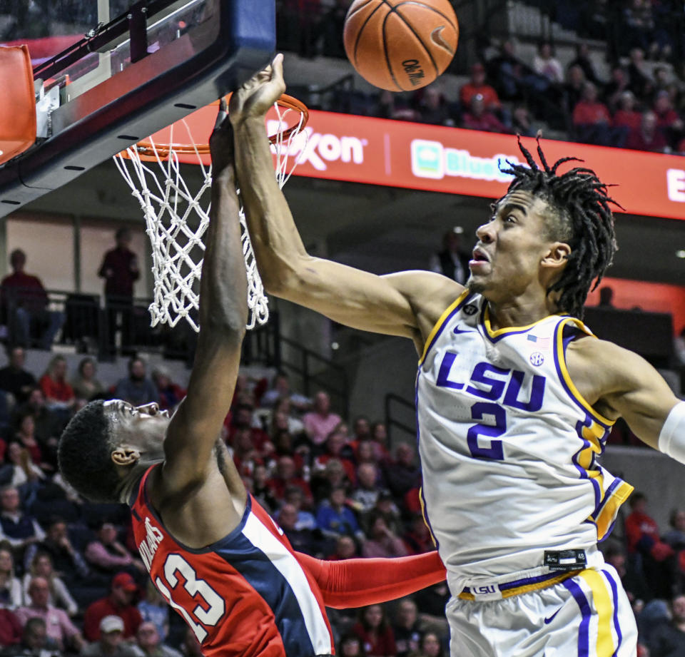 LSU forward Trendon Watford (2) blocks a shot by Mississippi guard Bryce Williams (13) during an NCAA college basketball game in Oxford, Miss., Saturday, Jan. 18, 2020. (Bruce Newman/The Oxford Eagle via AP)