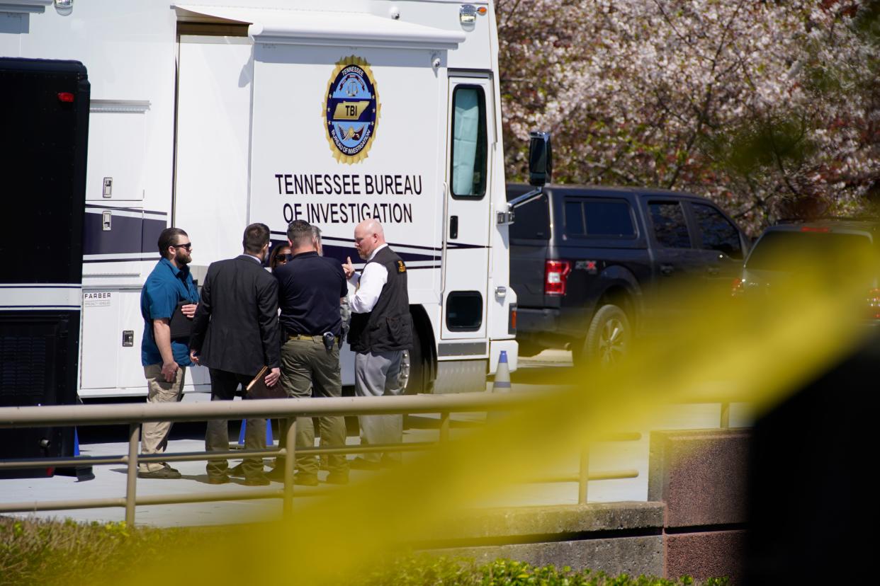 Police officers gather near The Covenant School, a private Christian school in Nashville, Tenn., after this week's deadly shooting.