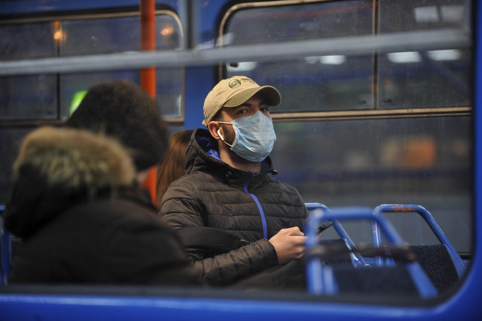  A man wearing a face mask as a precaution against the spread of Coronavirus rides on a tram in Kiev. Since March 12, 2020, Ukraine introduced a three-week quarantine for all educational institutions. The government made the corresponding decision today, March 11, 2020. From March 12, in Kiev, to prevent the spread of coronavirus, the educational process in general and higher education institutions, holding mass events, as well as closing entertainment centers and entertainment areas in shopping malls will be limited, said Vitaly Klitschko, the mayor of the capital. (Photo by Sergei Chuzavkov / SOPA Images/Sipa USA) 