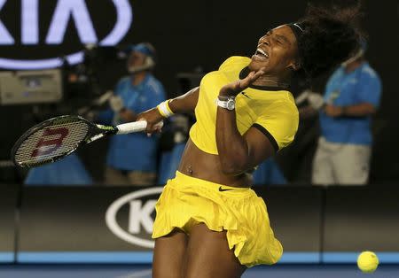 Serena Williams of the U.S. reacts after being hit by a ball during her final match against Germany's Angelique Kerber at the Australian Open tennis tournament at Melbourne Park, Australia, January 30, 2016. REUTERS/Tyrone Siu