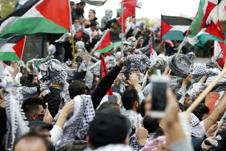 Protestors wave the Palestinian flag during a demonstration outside the US embassy in Awkar, on the outskirts of the Lebanese capital Beirut, on December 10, 2017