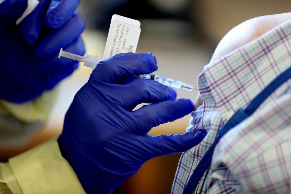 A COVID-19 vaccine is administered at St. John's Riverside Hospital in Yonkers, N.Y.  Dec. 15, 2020. Forty staff members received the vaccine at the hospital Tuesday.