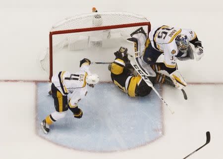 May 29, 2017; Pittsburgh, PA, USA; Pittsburgh Penguins center Sidney Crosby (87) collides with Nashville Predators goalie Pekka Rinne (35) during the second period in game one of the 2017 Stanley Cup Final at PPG PAINTS Arena. Mandatory Credit: Charles LeClaire-USA TODAY Sports