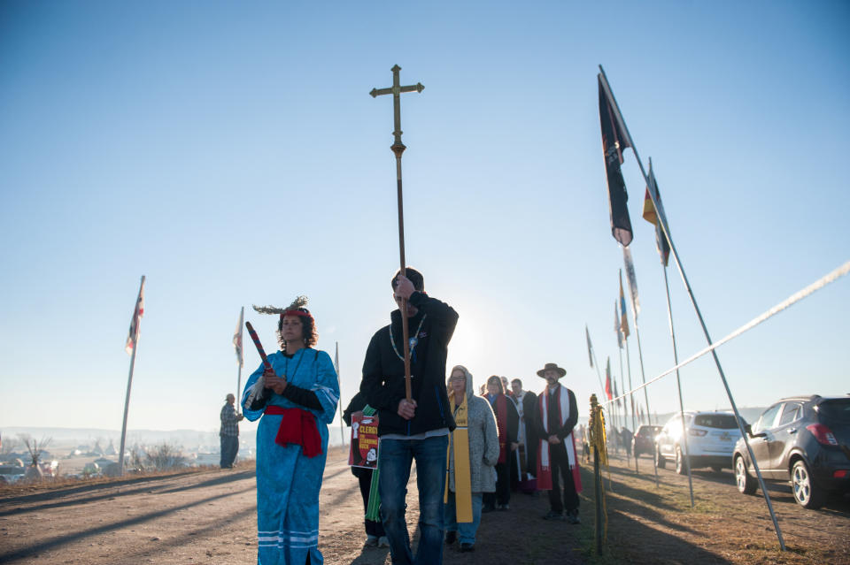 Members of the clergy from across the United States participate in a march during a protest.