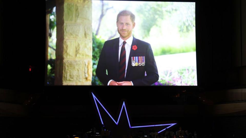 new york, new york november 06 prince harry, duke of sussex appears onstage in a video message during the 17th annual stand up for heroes benefit presented by bob woodruff foundation and ny comedy festival at david geffen hall on november 06, 2023 in new york city photo by mike coppolagetty images for bob woodruff foundation