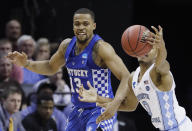 North Carolina guard Nate Britt (0) grabs a loose ball ahead of Kentucky guard Isaiah Briscoe (13) in the first half of the South Regional final game in the NCAA college basketball tournament Sunday, March 26, 2017, in Memphis, Tenn. (AP Photo/Mark Humphrey)