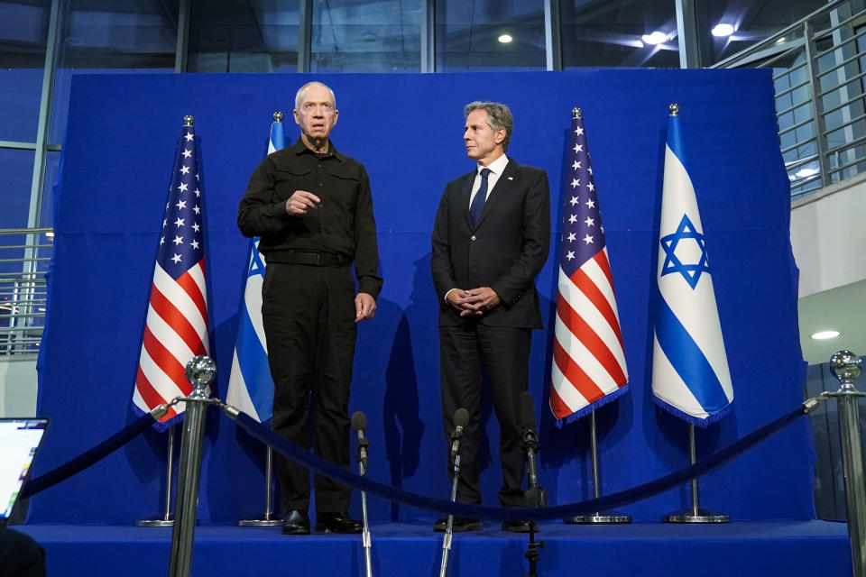 U.S. Secretary of State Antony Blinken, right, and Israeli Defense Minister Yoav Gallant make brief statements to the media at The Kirya, Israel's Ministry of Defense, Monday, Oct. 16, 2023, in Tel Aviv. (AP Photo/Jacquelyn Martin, Pool)