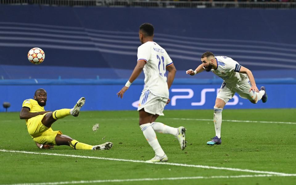 Karim Benzema of Real Madrid scores their team's second goal during the UEFA Champions League Quarter Final Leg Two match between Real Madrid and Chelsea FC at Estadio Santiago Bernabeu on April 12, 2022 in Madrid, Spain - Getty Images Europe 