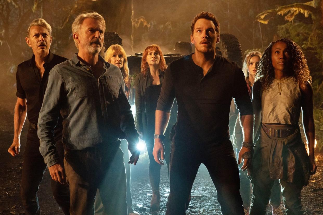 (from left) Dr. Ian Malcolm (Jeff Goldblum), Dr. Alan Grant (Sam Neill), Dr. Ellie Sattler (Laura Dern), Claire Dearing (Bryce Dallas Howard), Owen Grady (Chris Pratt), Maisie Lockwood (Isabella Sermon) and Kayla Watts (DeWanda Wise) in Jurassic World Dominion, co-written and directed by Colin Trevorrow.