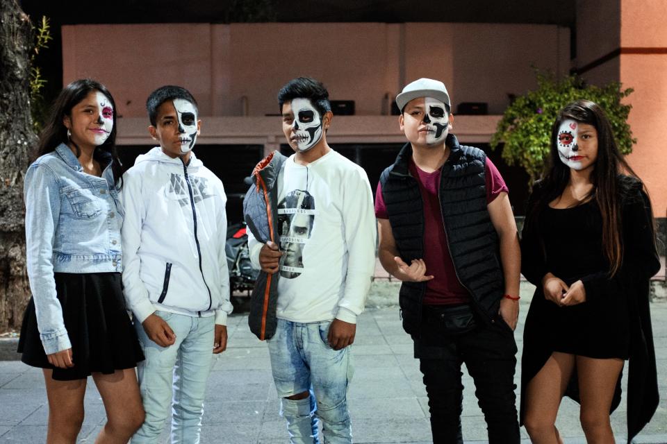 Xochimilco youth, with their faces painted as Catrines.