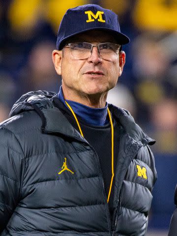 <p>Aaron J. Thornton/Getty</p> Jim Harbaugh of the Michigan Wolverines is seen on the field before a college football game against the Purdue Boilermakers at Michigan Stadium on November 04, 2023.