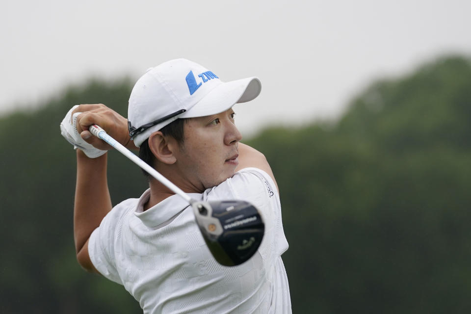 S.Y. Noh, of South Korea, watches a tee shot on the 10th hole during the first round of the Byron Nelson golf tournament in McKinney, Texas, Thursday, May 11, 2023. (AP Photo/LM Otero)