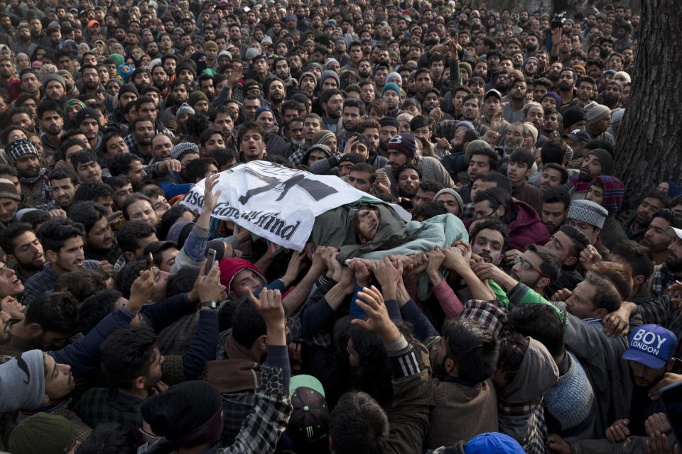 Kashmiri villagers carry the body of Rouf Mir, a local rebel during a joint funeral procession of four rebels in Tral, south of Srinagar, Indian controlled Kashmir, Saturday, Dec. 22, 2018. A gunbattle between Indian troops and Kashmiri rebels early Saturday left six militants dead and triggered a new round of anti-India protests in the disputed Himalayan region. (AP Photo/Dar Yasin)