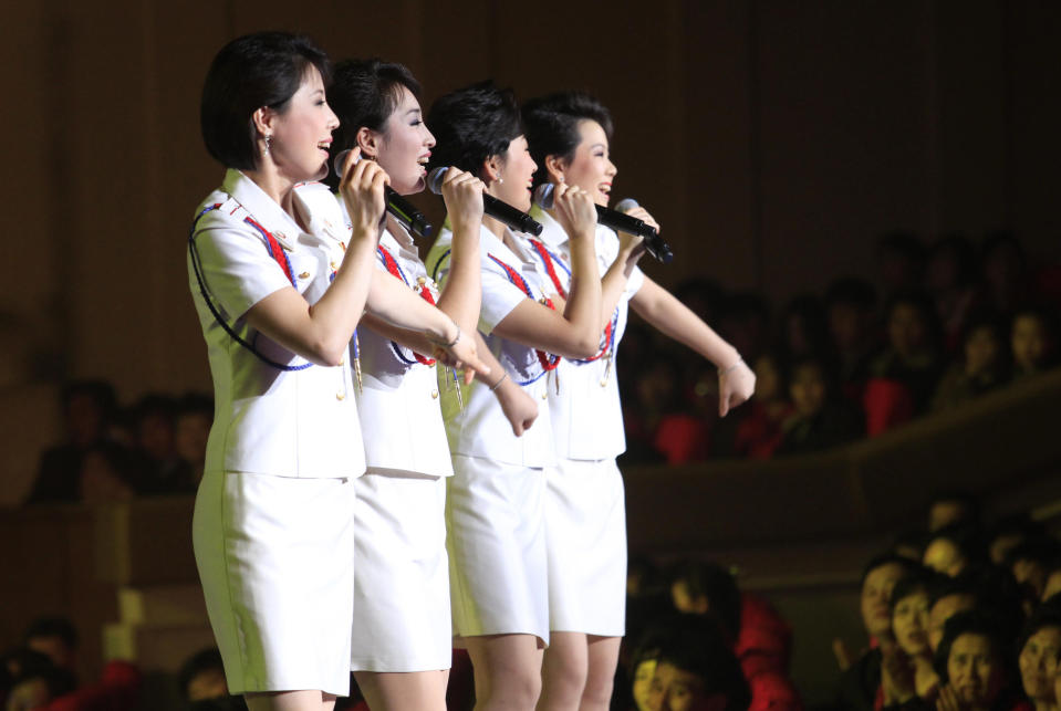 In this Friday, March 28, 2014 photo, singers of the Moranbong Band perform on their stage in Pyongyang, North Korea. Step aside, Sea of Blood Opera. North Korean leader Kim Jong Un’s favorite guitar-slinging, miniskirt-sporting girl group, the Moranbong Band, is back. And these ladies know how to shimmy. (AP Photo/Jon Chol Jin)