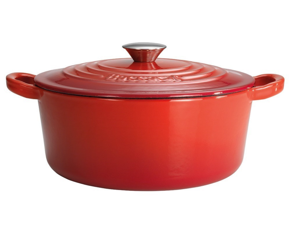 A red casserole dish with lid on a white background