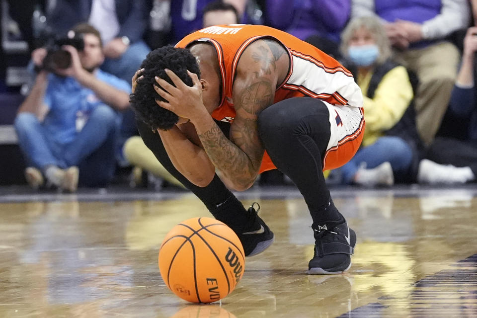 Illinois guard Justin Harmon reacts after he was called for a foul on Northwestern guard Brooks Barnhizer during the second half of an NCAA college basketball game in Evanston, Ill., Wednesday, Jan. 24, 2024. (AP Photo/Nam Y. Huh)