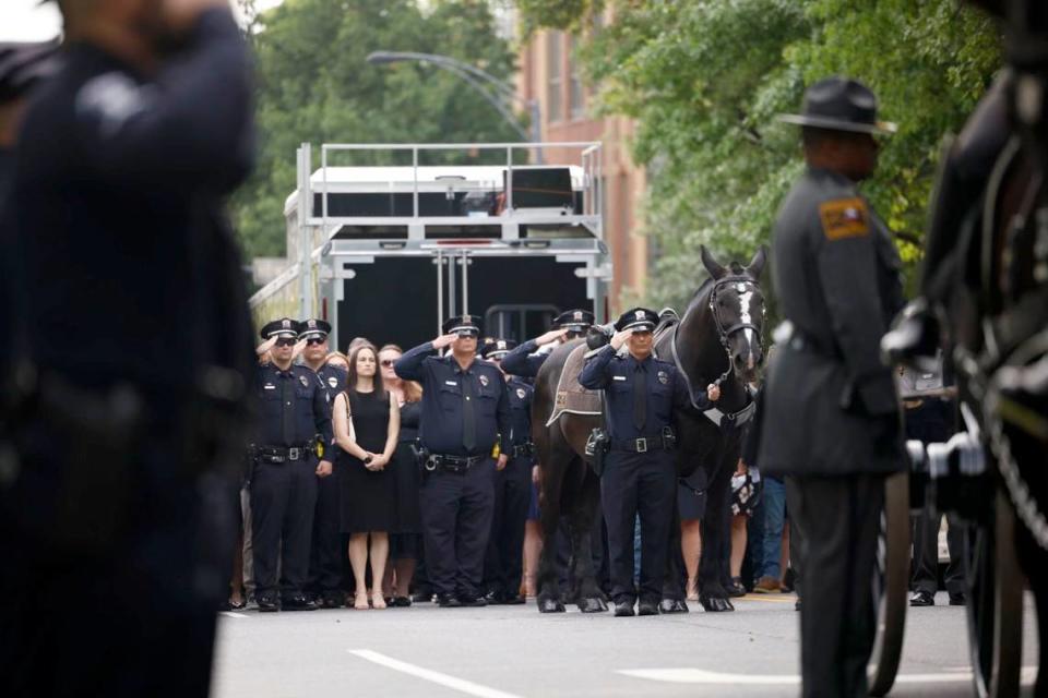 Law officers line up for the processional of Charlotte-Mecklenburg Police Officer Eyer on Friday to First Baptist Church on Friday, May3, 2024. Officer Eyer was killed while serving a warrant in east Charlotte on Monday, April 29, 2024