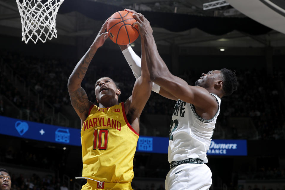 Maryland forward Julian Reese (10) and Michigan State center Mady Sissoko, right, vie for a rebound during the first half of an NCAA college basketball game, Saturday, Feb. 3, 2024, in East Lansing, Mich. (AP Photo/Al Goldis)