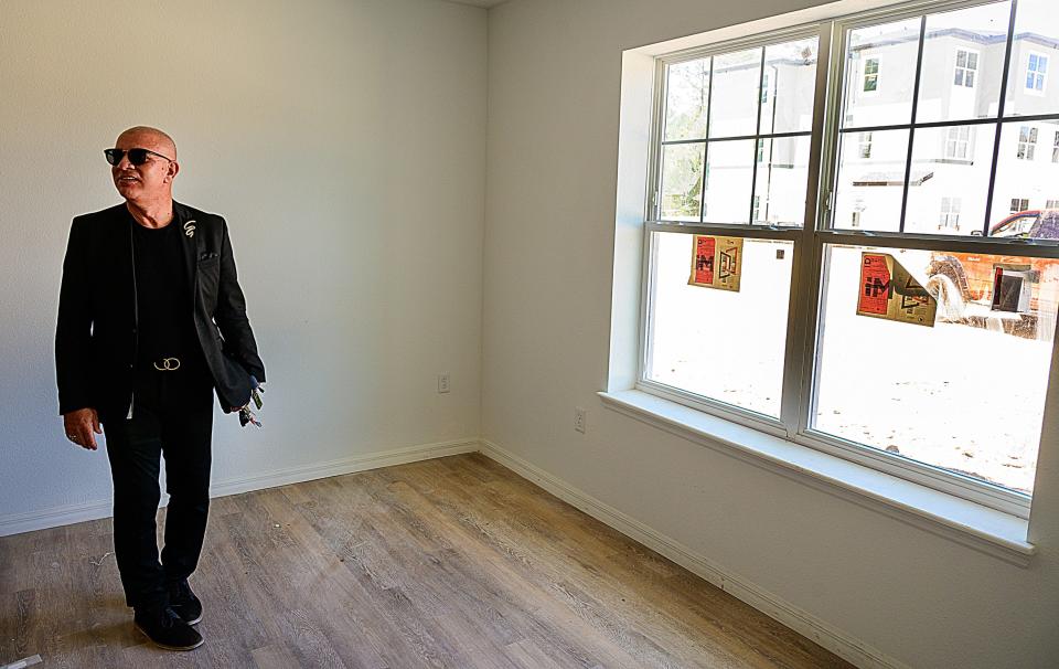 Roberto Ortiz, St. Johns County housing and community services manager, stands in a bedroom of an apartment in the San Marcos Heights complex under construction off State Road 207 in St. Augustine on Wednesday, May 11, 2022.