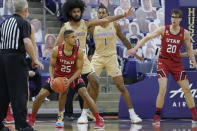 Utah guard Alfonso Plummer (25) looks to pass as Washington guard Marcus Tsohonis (0) defends during the first half of an NCAA college basketball game, Sunday, Jan. 24, 2021, in Seattle. (AP Photo/Ted S. Warren)