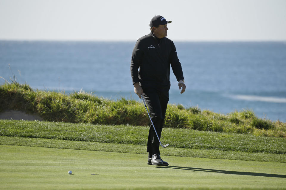 Phil Mickelson reacts after missing a birdie putt on the fourth green of the Pebble Beach Golf Links during the final round of the AT&T Pebble Beach National Pro-Am golf tournament Sunday, Feb. 9, 2020, in Pebble Beach, Calif. (AP Photo/Eric Risberg)