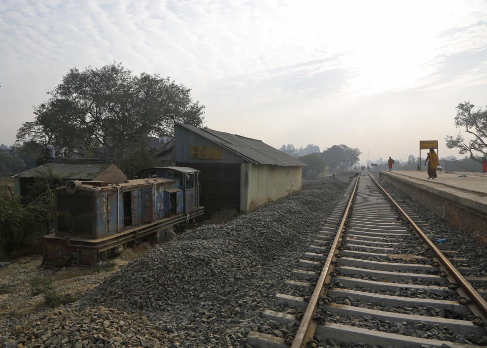 In this Nov. 29, 2018 photo, an old train engine is seen next to the newly built train tracks connecting the 34 kilometers (21 miles) between Janakpur in southeastern Nepal and Jay Nagar in the Indian state of Bihar at Janakpur in Nepal. The competition between two Asian giants, India and China, for influence over tiny Nepal is yielding a bonanza in the form of the Himalayan mountain nation’s first modern railway, and possibly more to come. (AP Photo/Niranjan Shrestha)