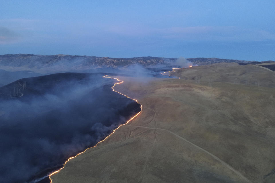 This photo released by the The California Department of Forestry and Fire Protection shows the Corral Fire burning on Sunday, June 2, 2024, near Tracy, Calif. (California Department of Forestry and Fire Protection via AP)