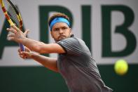 France's Jo-Wilfried Tsonga returns the ball to Germany's Peter Gojowczyk during their men's singles first round match on day two of The Roland Garros 2019 French Open tennis tournament in Paris on May 27, 2019. (Photo by Anne-Christine Poujoulat/AFP/Getty Images)