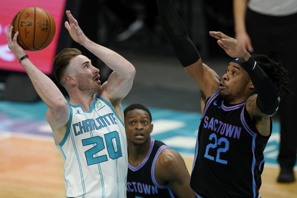 Charlotte Hornets forward Gordon Hayward shoots over Sacramento Kings center Richaun Holmes during the second half of an NBA basketball game on Monday, March 15, 2021, in Charlotte, N.C. (AP Photo/Chris Carlson)