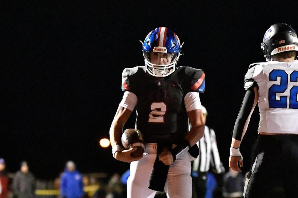 Christian Academy-Louisville’s Cole Hodge (2) flexes after scoring a touchdown during the first half of his team’s game against Lexington Catholic.