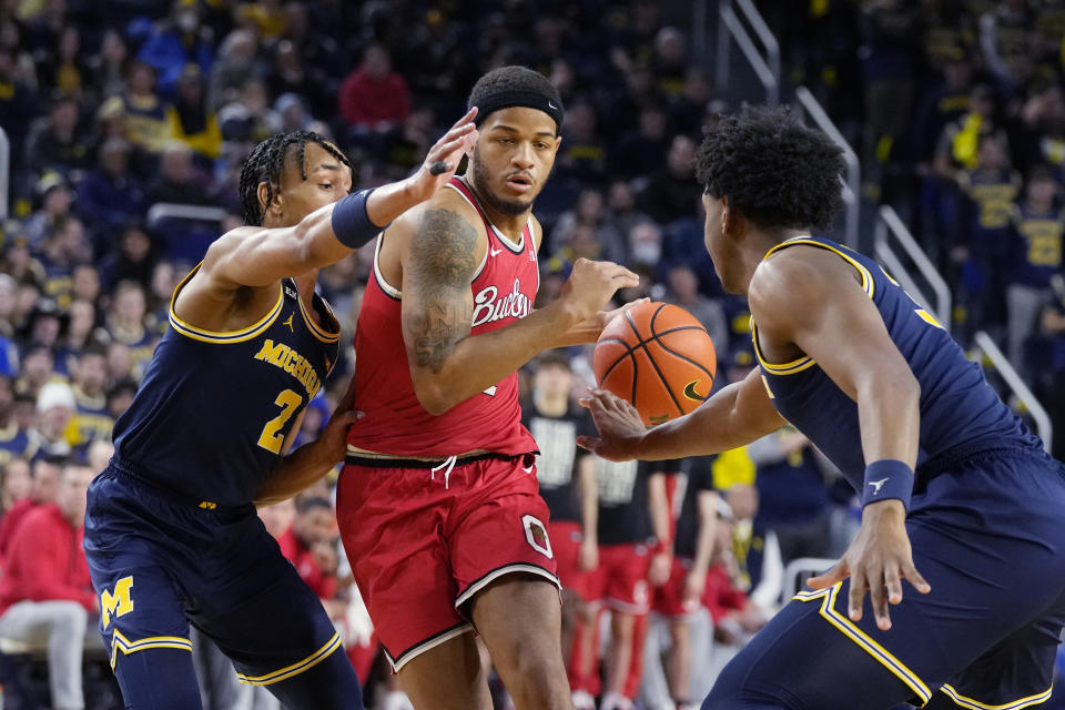 Ohio State guard Roddy Gayle Jr. (1) drives next to Michigan guard Kobe Bufkin (2) during the first half of an NCAA college basketball game, Sunday, Feb. 5, 2023, in Ann Arbor, Mich. (AP Photo/Carlos Osorio)