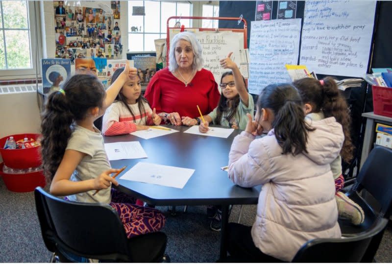 Missy Testerman works with elementary school students for whom English is a second language so they can learn and succeed. Photo courtesy of the Tennessee Department of Education/UPI