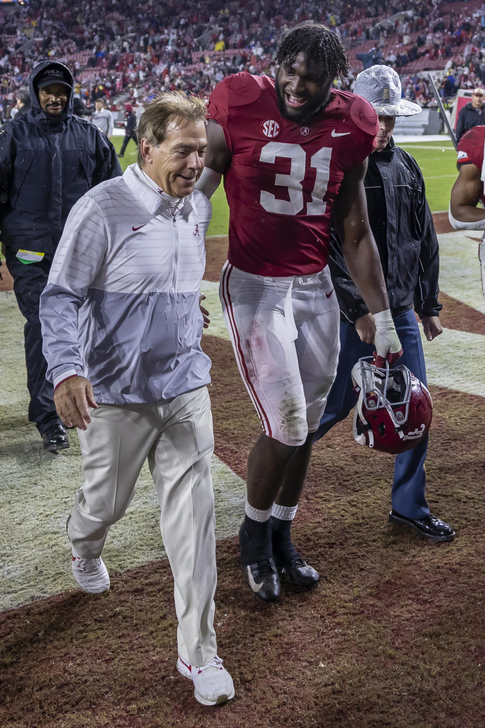 Alabama head coach Nick Saban, front left, and linebacker Will Anderson Jr. (31) depart the field after an NCAA college football game against Auburn, Saturday, Nov. 26, 2022, in Tuscaloosa, Ala. (AP Photo/Vasha Hunt)