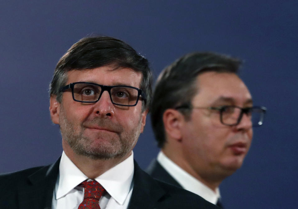 Matthew Palmer, Deputy Assistant Secretary of the U.S.Department of State - Bureau of European and Eurasian Affairs, left, and Serbian President Aleksandar Vucic arrive for a news conference after their meeting in Belgrade, Serbia, Monday, Nov. 4, 2019. The U.S. has intensified efforts to help relaunch stalled talks on normalizing relations between Serbia and Kosovo, a former province whose 2008 declaration of independence Belgrade does not recognize. (AP Photo/Darko Vojinovic)