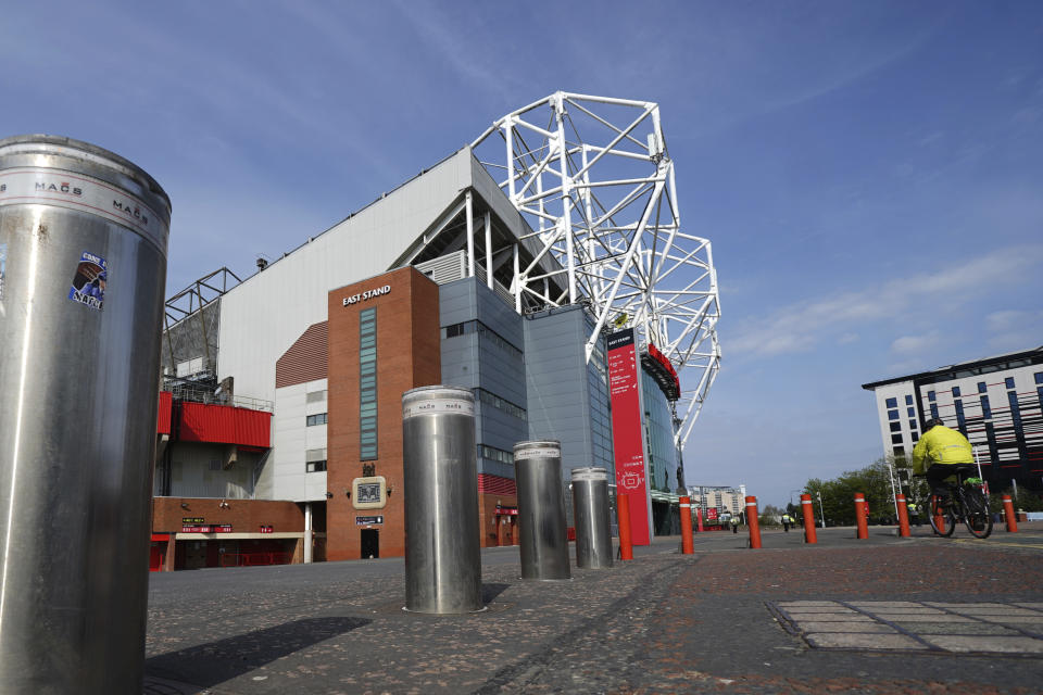 Bollards stand raised outside the closed Manchester United stadium, Old Trafford, in Manchester, northern England, as the English Premier League soccer season has been suspended due to coronavirus, Thursday, April 9, 2020. The new coronavirus causes mild or moderate symptoms for most people, but for some, especially older adults and people with existing health problems, it can cause more severe illness or death. (AP Photo/Jon Super)