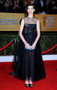 <b>Anne Hathaway <br></b><br>The Les Miserables actress dazzled in a black Giambattisa Valli SS13 Couture dress with matching peep toe heels.<br><br>Image © Rex