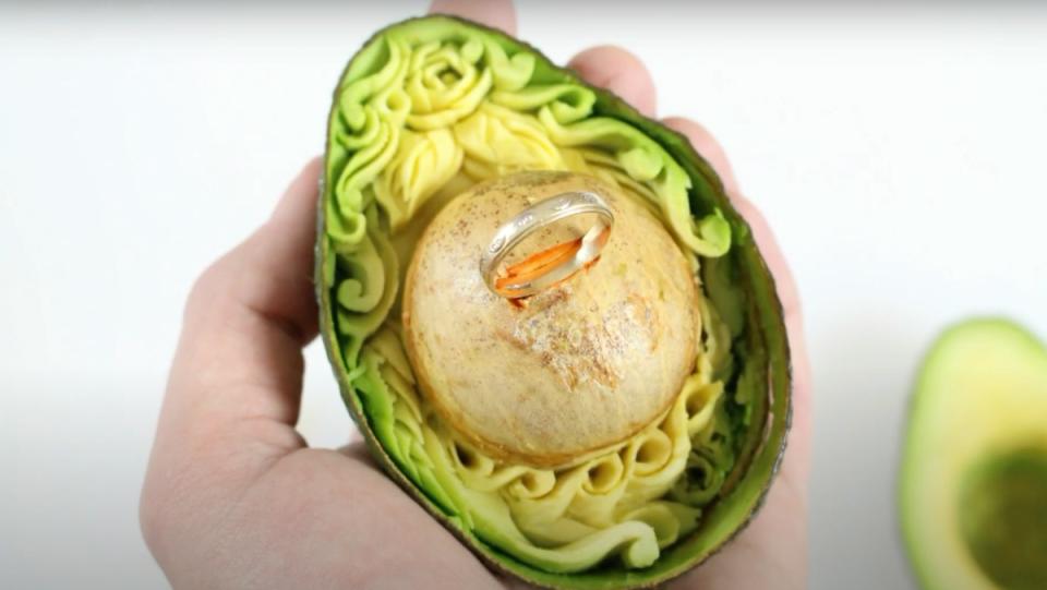 Daniele Barresi's avocado art carving used as a proposal vessel for a ring