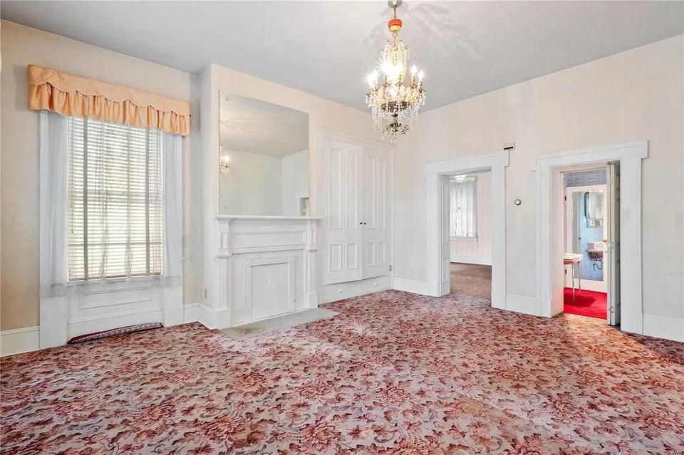 A room inside the Chenot mansion today includes a chandelier and one of the five fireplaces in the home.