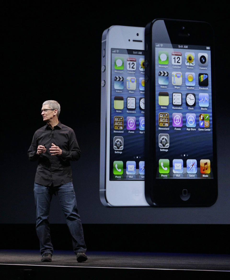 Apple CEO Tim Cook talks on stage during the introduction of the new iPhone 5 in San Francisco, Wednesday, Sept. 12, 2012. (AP Photo/Eric Risberg)