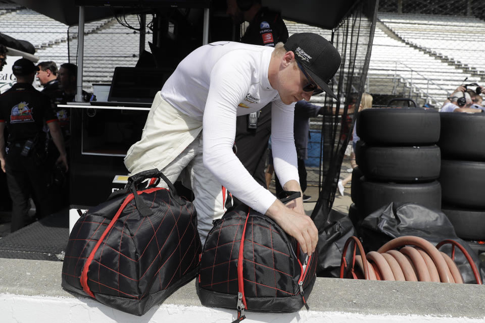 Spencer Pigot looks in his helmet case during practice for the Indianapolis 500 IndyCar auto race at Indianapolis Motor Speedway, Friday, May 17, 2019 in Indianapolis. (AP Photo/Darron Cummings)