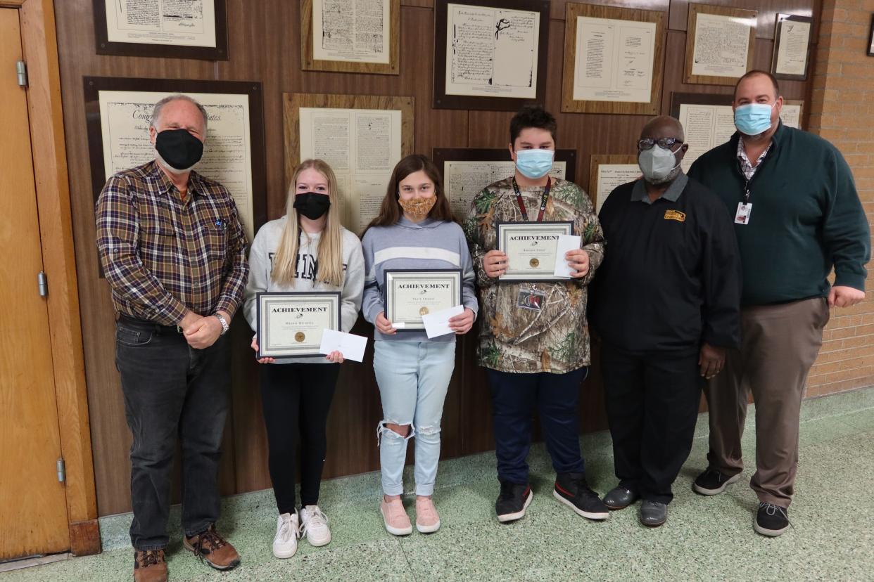 Pictured are the winners of the 2022 Martin Luther King Jr. essay contest. The winners were all from Churchill Junior High School. From left are Maury Lyon, Maddie Michaels (third place),  Neave Frisque (first place), Bracken Foust (second place), Dwight White and Churchill principal Nick Young.