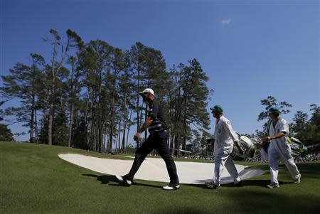 Denmark's Thomas Bjorn walks to the sixth green during the third round of the Masters golf tournament at the Augusta National Golf Club in Augusta, Georgia April 12, 2014. REUTERS/Brian Snyder