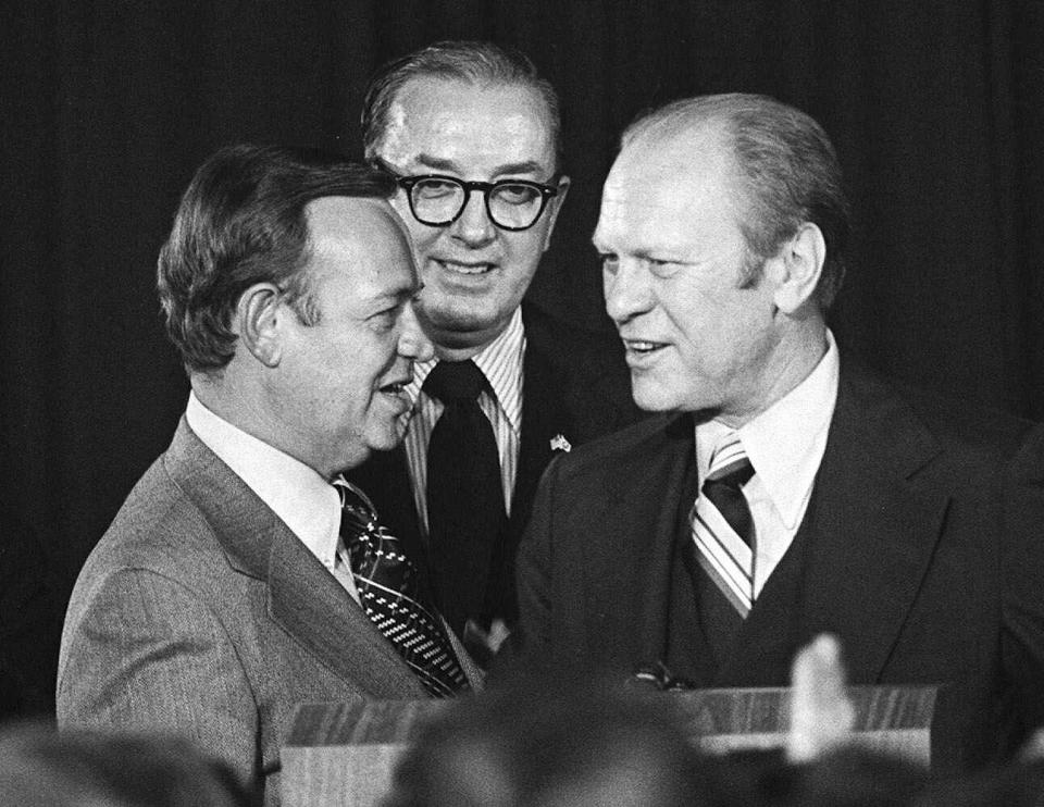 President Ford talks with North Carolina Congressman Jim Broyhill, left, and Sen. Jesse Helms, center, during a Republican fund raising visit to Raleigh in this Nov. 14, 1975 photo. Broyhill who served briefly in the Senate in the mid-1980s has died. The family of Jim Broyhill confirmed he died early Saturday, Feb. 18, 2023 in Winston-Salem at the age of 95. (AP Photo, File)