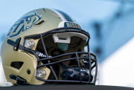 A football helmet that helps Deaf and hard-of-hearing players see play calls on a lens inside is displayed before an NCAA college football game between the Gallaudet Bisons and Hilbert College, Saturday, Oct. 7, 2023, in Washington. (AP Photo/Stephanie Scarbrough)