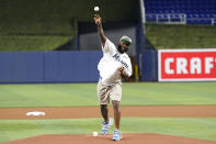 Miami Dolphins cornerback Xavien Howard throws a ceremonial pitch before a baseball game between the Miami Marlins and the Tampa Bay Rays, Wednesday, Aug. 31, 2022, in Miami. (AP Photo/Lynne Sladky)