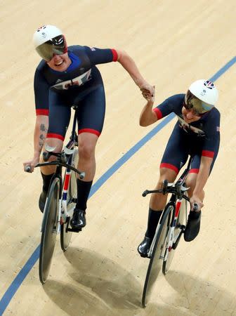 2016 Rio Olympics - Cycling Track - Women's Team Pursuit Final Gold Race - Rio Olympic Velodrome - Rio de Janeiro, Brazil - 13/08/2016. Kate Archibald (GBR) of Britain and Laura Trott (GBR) of Britain celebrate winning the final gold race. REUTERS/Paul Hanna