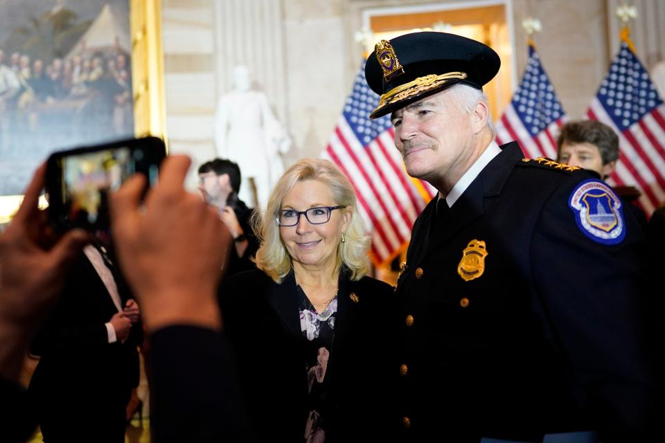 Rep. Liz Cheney, R-Wyo., and U.S. Capitol Police Chief J. Thomas Manger, pose for a photo after a Congressional Gold Medal ceremony on Dec. 6 honoring law enforcement officers who defended the U.S. Capitol on Jan. 6, 2021.