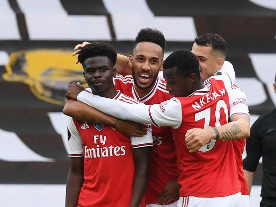 Arsenal celebrate after Saka scores (Getty)